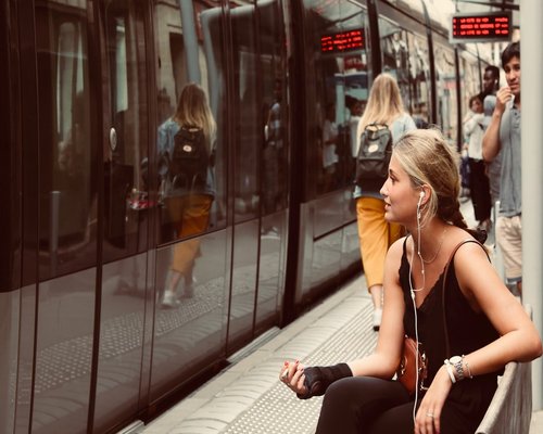 Commuters standing comfortably in modern public transport